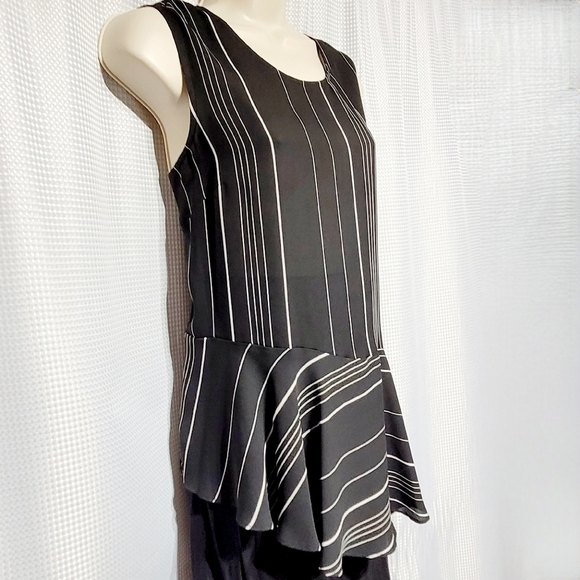 Marled Sleeveless Black with White Stripes Asymmetric Peplum Blouse (L) - Picture 2 of 9